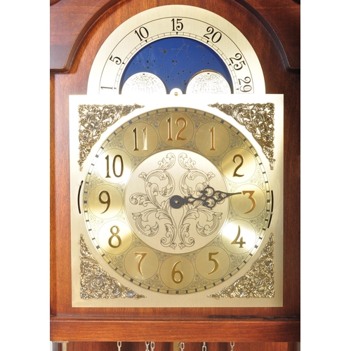 1539 - A 20th century German made reproduction grandfather - longcase clock within a mahogany veneer case w... 