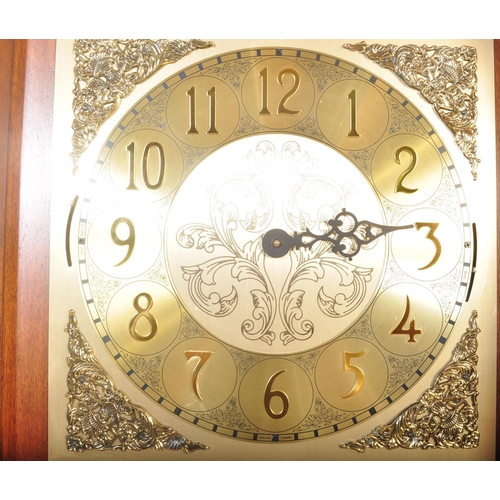 1539 - A 20th century German made reproduction grandfather - longcase clock within a mahogany veneer case w... 