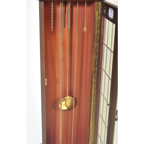 1543 - A 20th century German made Grandfather longcase clock within mahogany veneer case having gilded face... 