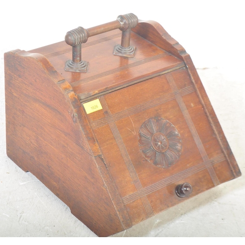 1547 - A Victorian 19th century circa. 1900's Arts and Crafts era mahogany purdonium coal scuttle. The coal... 