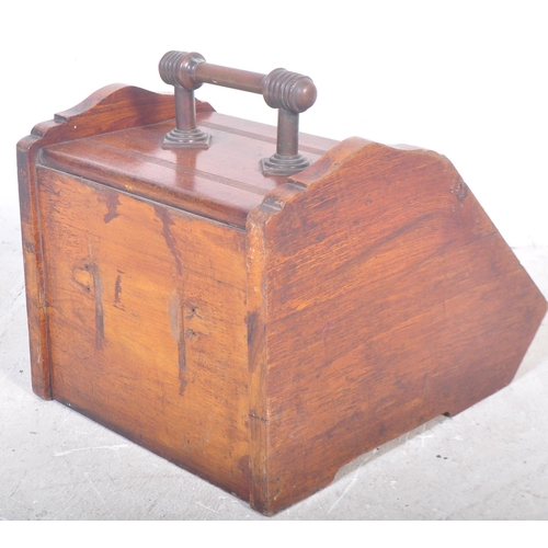 1547 - A Victorian 19th century circa. 1900's Arts and Crafts era mahogany purdonium coal scuttle. The coal... 