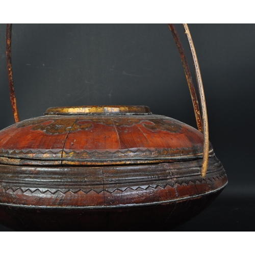 1562 - An early 20th Century oriental Asian Chinese food container / carrier. With bamboo and cane carry ha... 