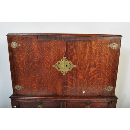 1572 - An early 20th Century, circa 1920's block fronted oak chest on stand / drinks cabinet. Of rectangula... 