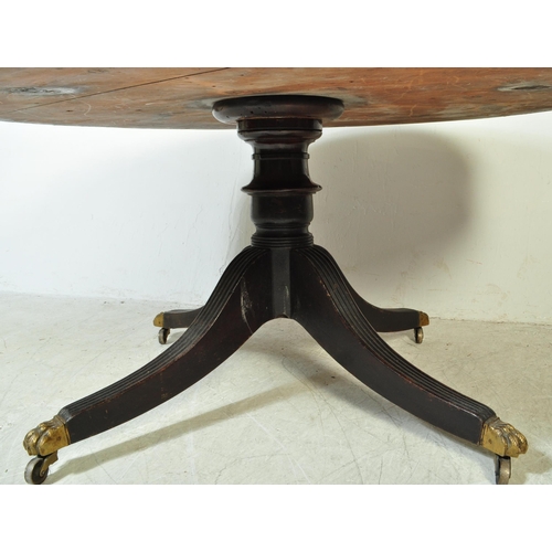 1574 - A late 19th mahogany drum table. With a round circular top, inlaid gilt red leather top with faux dr... 