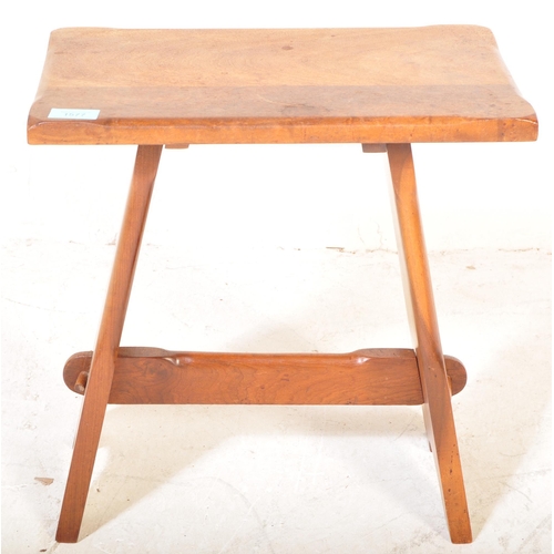 1577 - 1920’s Arts & Crafts oak joint stool. Carved rustic form with peg jointed supports having stretcher ... 