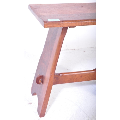 1577 - 1920’s Arts & Crafts oak joint stool. Carved rustic form with peg jointed supports having stretcher ... 