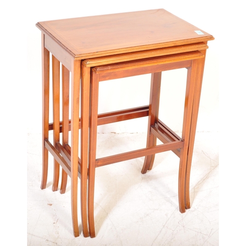 1581 - An Edwardian mahogany line inlaid nest of tables. Raised on squared legs with stretchers having grad... 