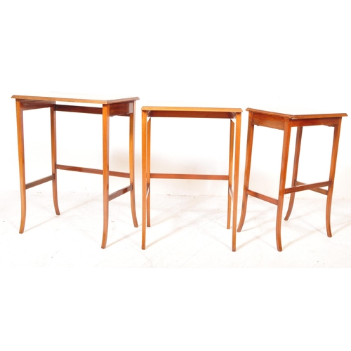 1581 - An Edwardian mahogany line inlaid nest of tables. Raised on squared legs with stretchers having grad... 