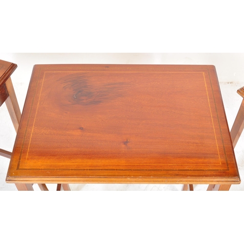 1581 - An Edwardian mahogany line inlaid nest of tables. Raised on squared legs with stretchers having grad... 