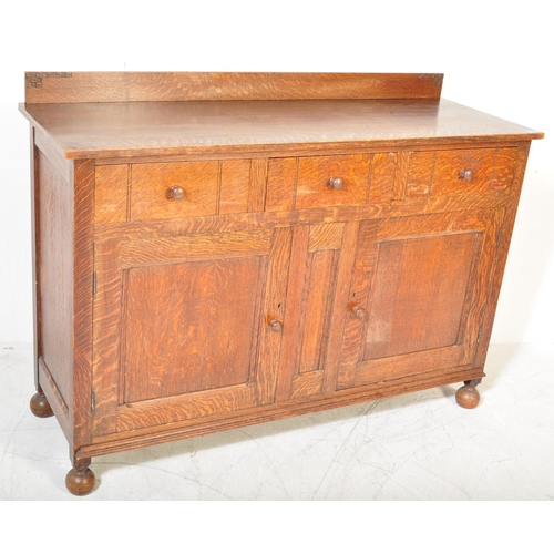 1585 - 1920's solid oak Arts & Crafts - Cotswold School sideboard credenza. Raised on bell feet with a pair... 