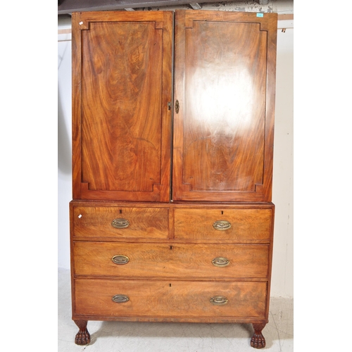 1590 - A 19th century mahogany linen press being raised on hairy paw feet with a short and deep drawer ches... 