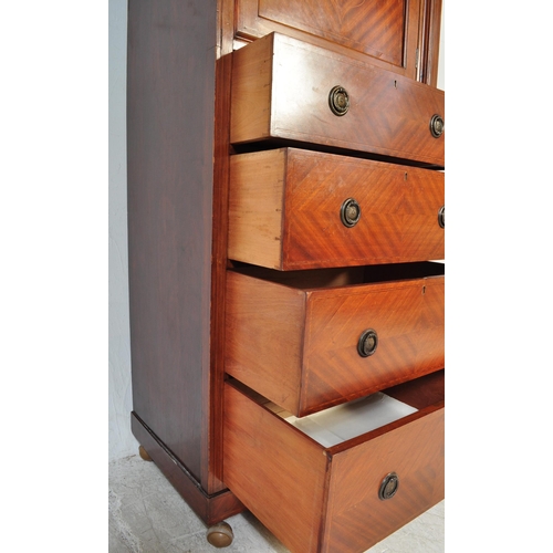 1594 - An  Edwardian mahogany sentry box wardrobe. Of upright form  having cupboard over chest of drawers b... 