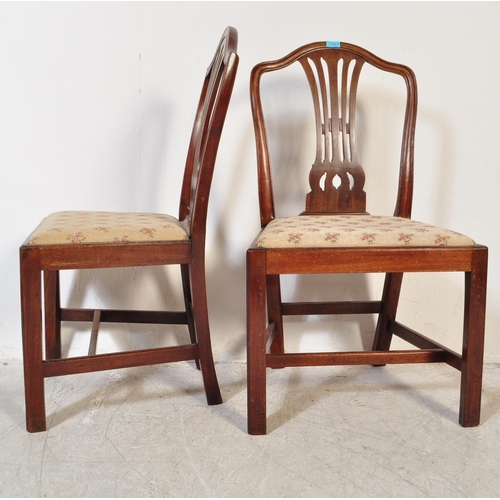 1596 - A Harlequin set of 19th century mahogany Hepplewhite dining chairs of similar design with pierced va... 