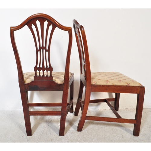 1596 - A Harlequin set of 19th century mahogany Hepplewhite dining chairs of similar design with pierced va... 