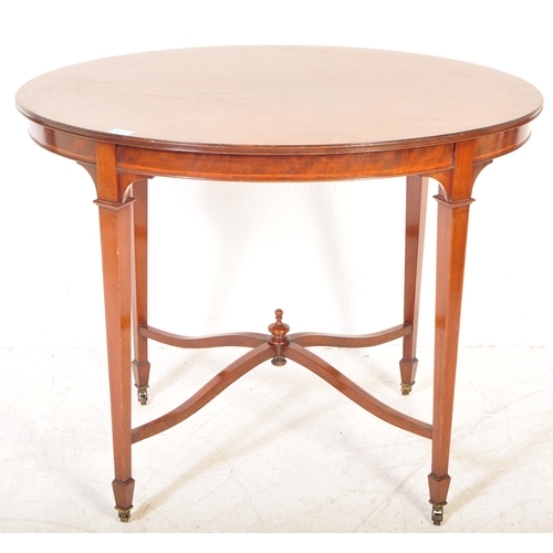 1602 - An  Edwardian mahogany and line inlaid oval occasional table. Raised on squared legs with angled fee... 