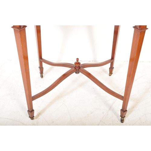 1602 - An  Edwardian mahogany and line inlaid oval occasional table. Raised on squared legs with angled fee... 