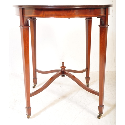 1602 - An  Edwardian mahogany and line inlaid oval occasional table. Raised on squared legs with angled fee... 