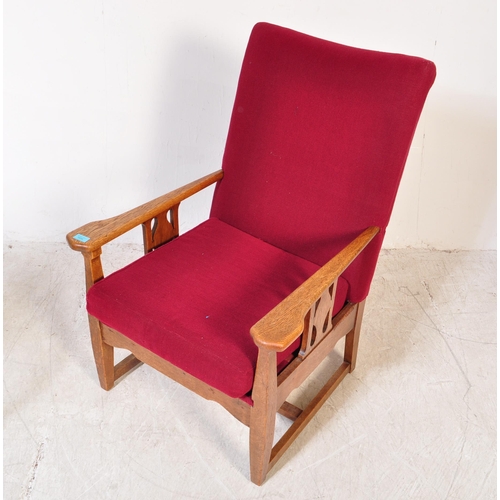 1604 - Arts & Crafts 1920’s fireside armchair raised on squared legs with returns, oak arm elbow rests with... 