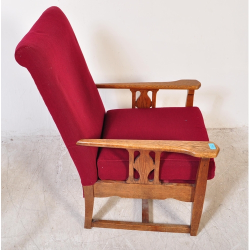 1604 - Arts & Crafts 1920’s fireside armchair raised on squared legs with returns, oak arm elbow rests with... 