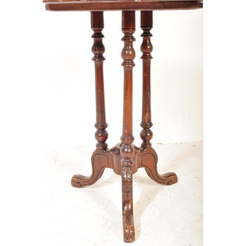 1605 - A 19th century Victorian aesthetic movement side table being raised on turned column supports with s... 