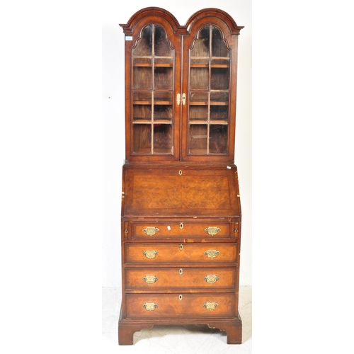 1607 - A 19th Century style revival Queen Anne burr walnut bureau bookcase. Having a double domed top with ... 