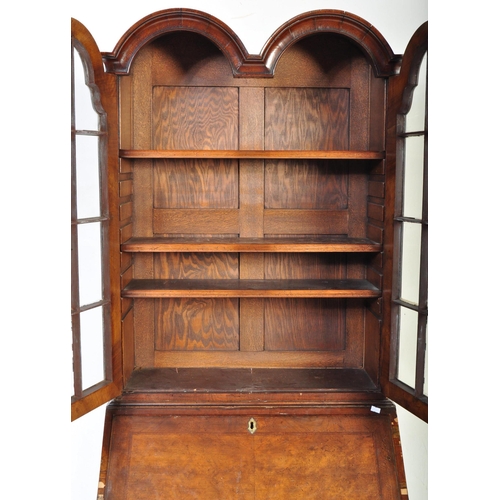 1607 - A 19th Century style revival Queen Anne burr walnut bureau bookcase. Having a double domed top with ... 