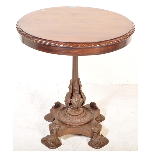 1608 - A 19th Century mahogany and cast iron tilt top pedestal wine table. The mahogany table top of circul... 