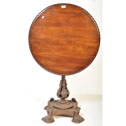 1608 - A 19th Century mahogany and cast iron tilt top pedestal wine table. The mahogany table top of circul... 