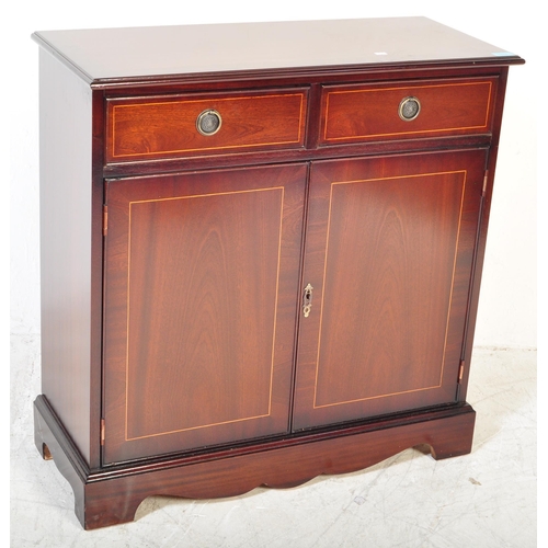 1612 - A 20th Century Regency revival mahogany veneer sideboard. The sideboard having satin wood borders wi... 