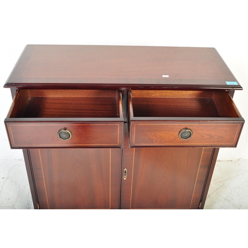 1612 - A 20th Century Regency revival mahogany veneer sideboard. The sideboard having satin wood borders wi... 