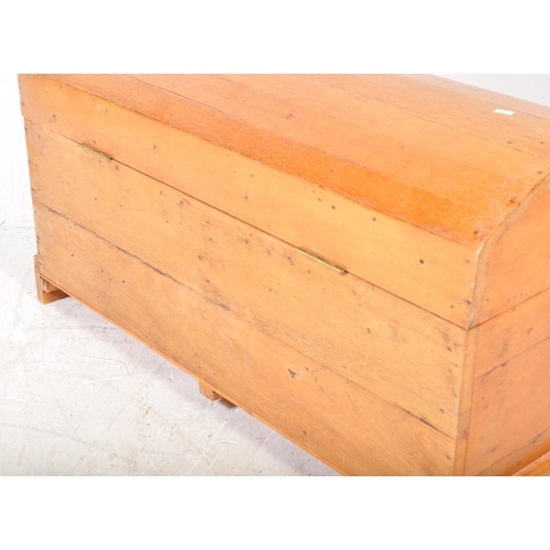 1615 - An early 20th Century pine dome topped trunk chest. The blanket box having a domed top, lock to fron... 