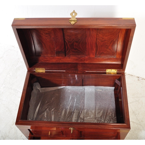 1616 - An Indian teak wood and brass inlaid dome top chest casket. The chest having a panelled dome top wit... 