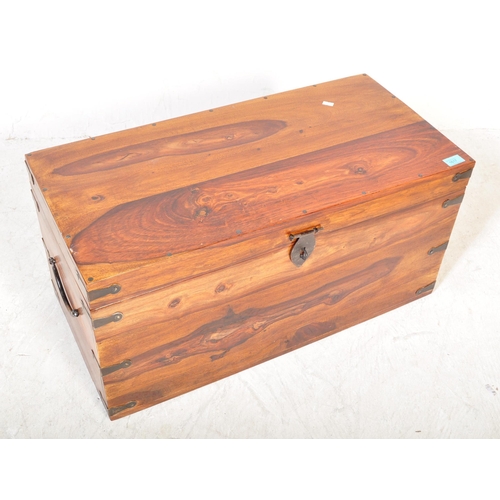 1617 - A contemporary hardwood blanket box chest trunk of Indian origin. The chest of rectangular form with... 