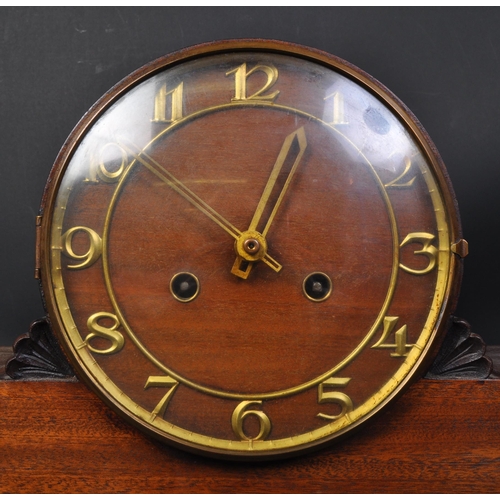 1634 - Art Deco 1920 / 1930s mahogany mantel clock . Having a round top with floral motifs to side, brass c... 