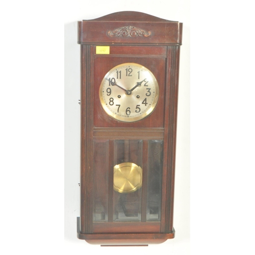 1650 - An early 20th century mahogany cased wall clock. The clock having silvered face with Arabic numeral ... 