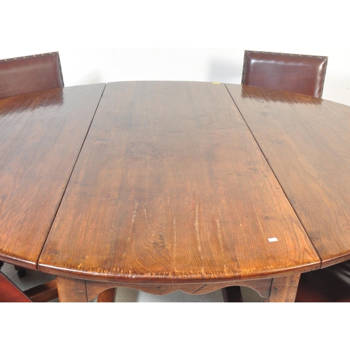 1657 - A Brights of Nettlebed 18th Century style oak oval drop leaf dining table and set of leather dining ... 