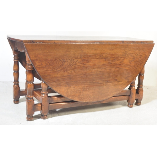 1657 - A Brights of Nettlebed 18th Century style oak oval drop leaf dining table and set of leather dining ... 