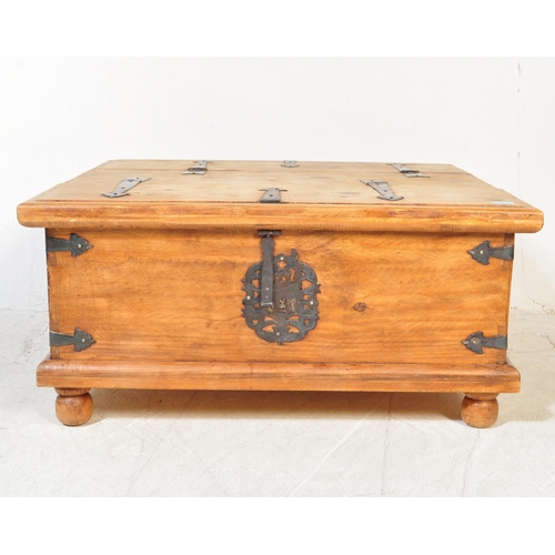 1680 - A 20th Century Mexican pine Pandora's box coffee table. Mexican pine planks with black cast and wrou... 