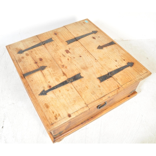 1680 - A 20th Century Mexican pine Pandora's box coffee table. Mexican pine planks with black cast and wrou... 