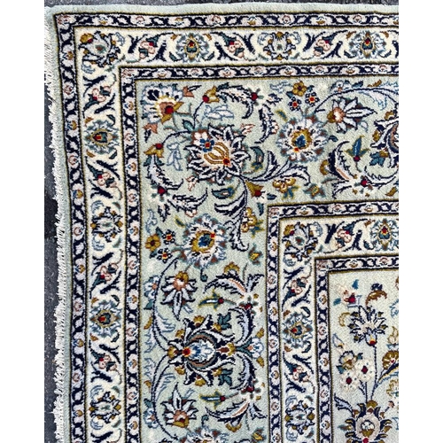 1641 - An early 20th century Central Persian Islamic Kashan floor carpet rug having a central panel with re... 