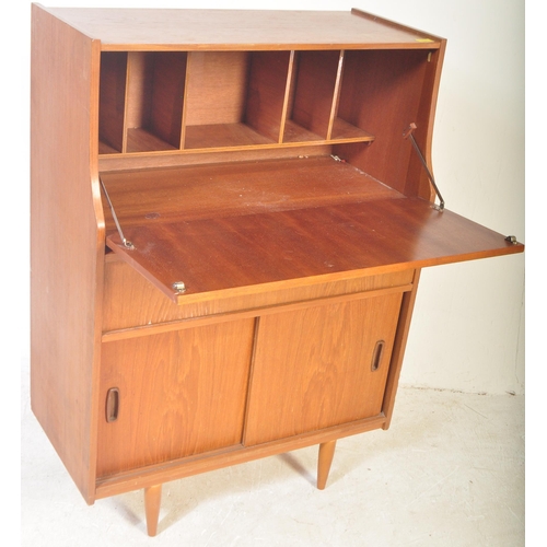 1241 - Mid century teak wood upright Danish influence bureau desk. The  upright body with fall front bureau... 