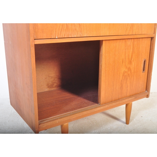 1241 - Mid century teak wood upright Danish influence bureau desk. The  upright body with fall front bureau... 