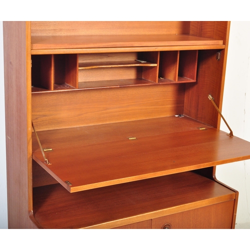 1243 - Mid century teak wood upright drinks cabinet with fall front centre over cupboard to the base with p... 