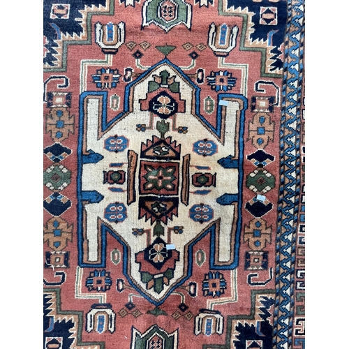 1468 - Early 20th Century Persian Islamic Malayer floor carpet rug. Having a central shaped medallion in a ... 