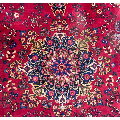 1519 - A mid 20th century Meshed Persian Islamic floor carpet rug having central floral medallion on a mage... 