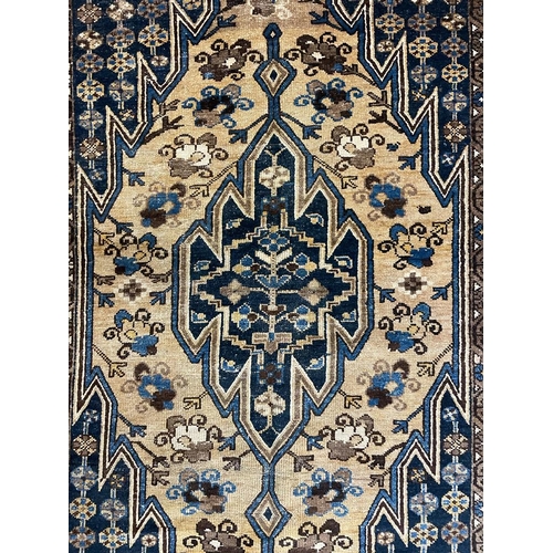 1546 - An early 20th century Persian Islamic Northwest Mazlaghan floor carpet rug having cream & cobalt blu... 