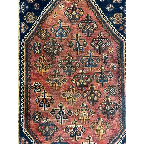 1550 - An early 20th century Central Persian Islamic Lori floor carpet rug having central red medallion wit... 