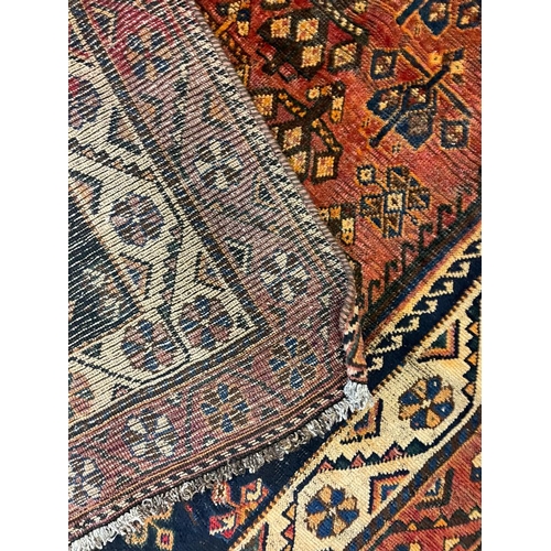 1550 - An early 20th century Central Persian Islamic Lori floor carpet rug having central red medallion wit... 