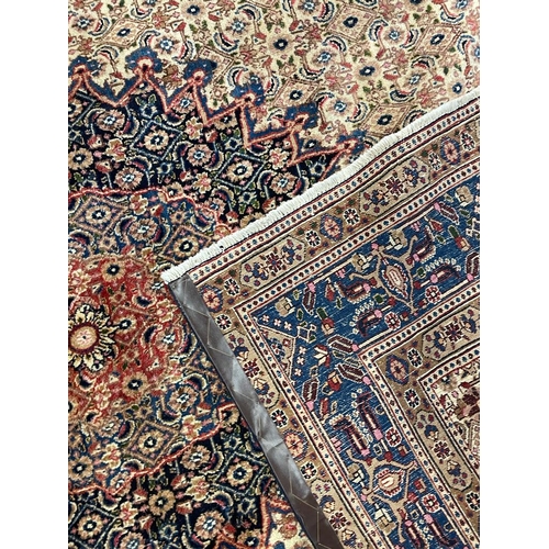 1552 - An early 20th century Persian Islamic North East Moud floor carpet rug having a central medallion on... 