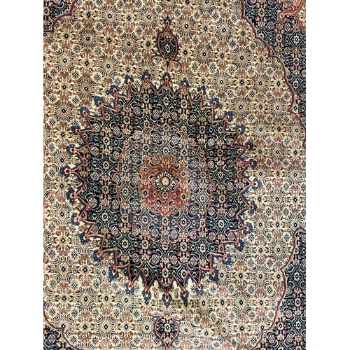 1552 - An early 20th century Persian Islamic North East Moud floor carpet rug having a central medallion on... 